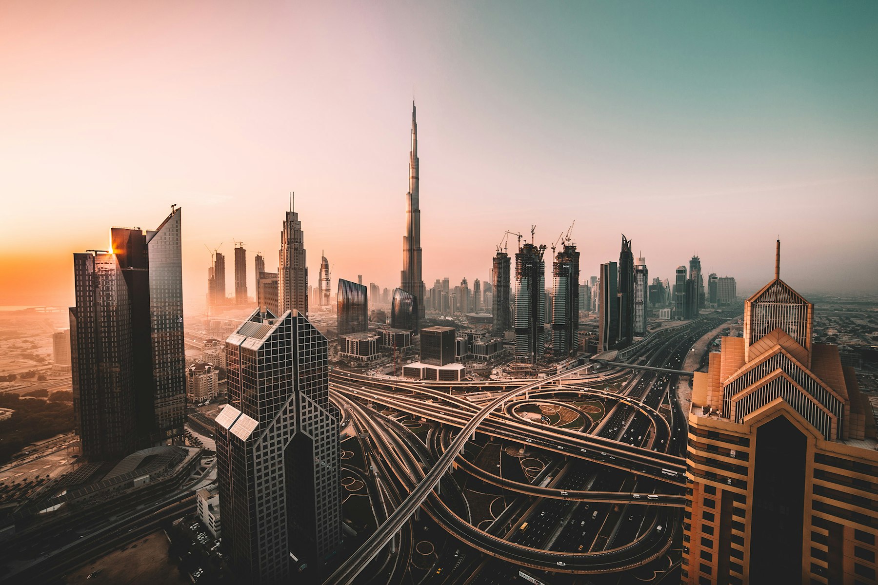 Dubai skyline and highways at sunset